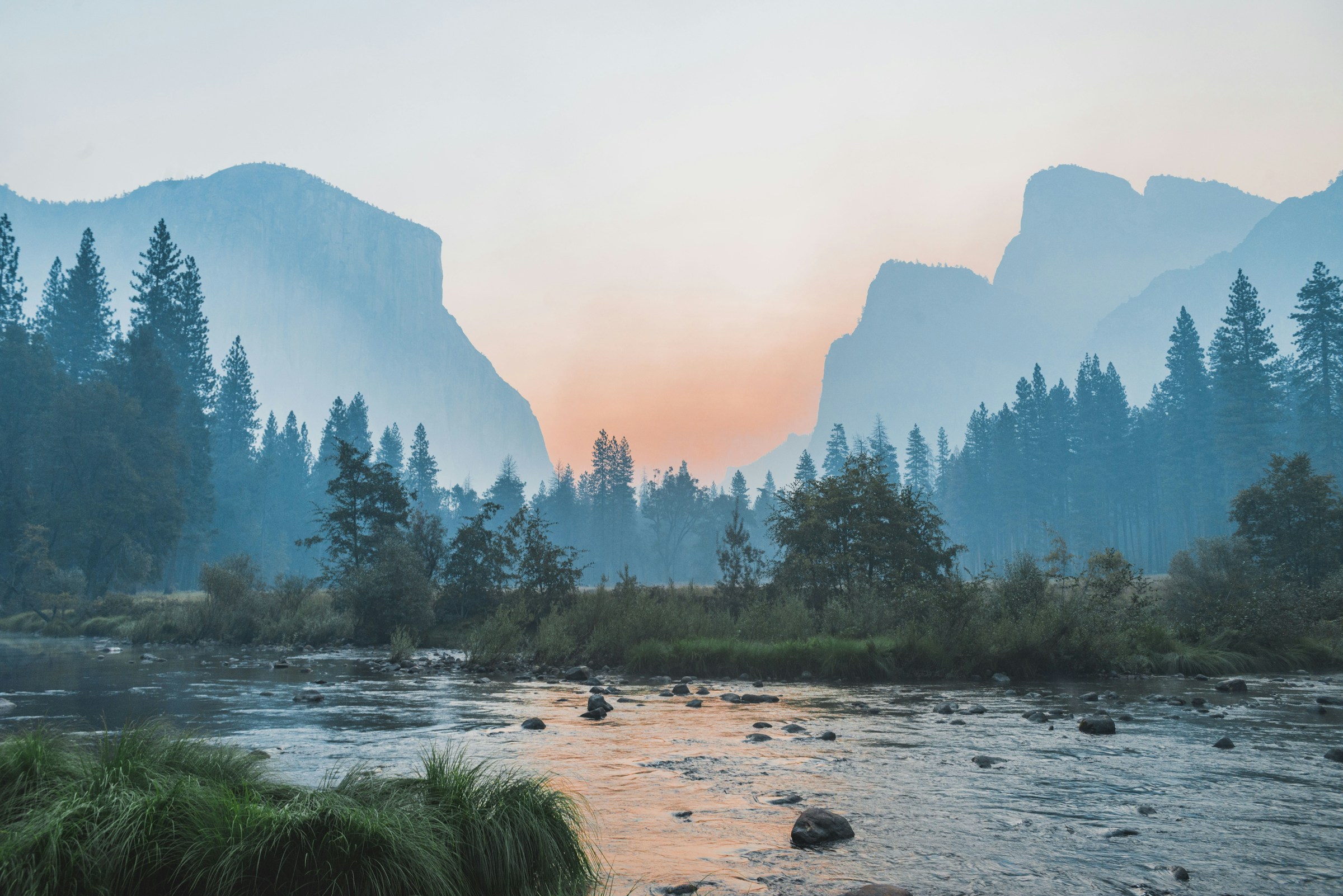Real Yosemite landscape photograph by Bailey Zindel showing water, trees, and granite cliffs